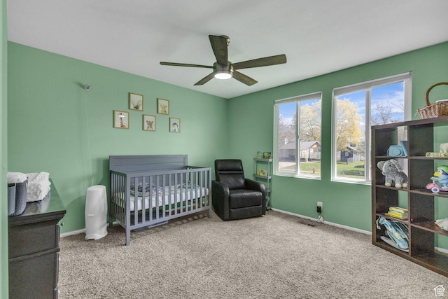 1282 S 875 W, Woods Cross, UT 84087 - bedroom featuring a crib, a ceiling fan, baseboards, and carpet