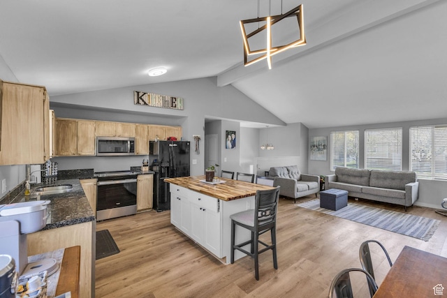 1282 S 875 W, Woods Cross, UT 84087 - kitchen with stainless steel appliances, a sink, light wood-type flooring, open floor plan, and butcher block counters