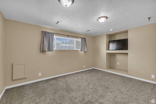 1282 S 875 W, Woods Cross, UT 84087 - carpeted spare room featuring visible vents, baseboards, and a textured ceiling