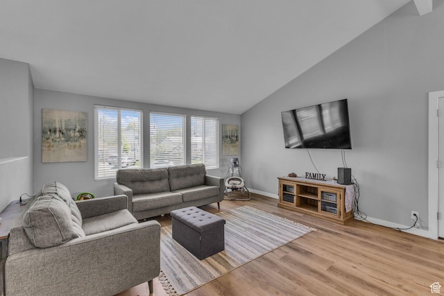 1282 S 875 W, Woods Cross, UT 84087 - living area featuring baseboards, vaulted ceiling, and wood finished floors
