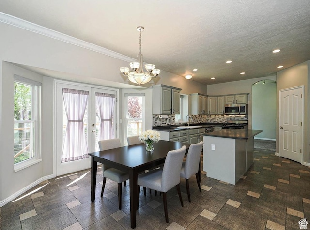 12261 S Stephens View Cir, Draper, UT 84020 - dining space with a chandelier, recessed lighting, a textured ceiling, crown molding, and french doors
