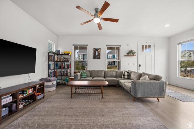 living room featuring recessed lighting, wood finished floors, and a ceiling fan
