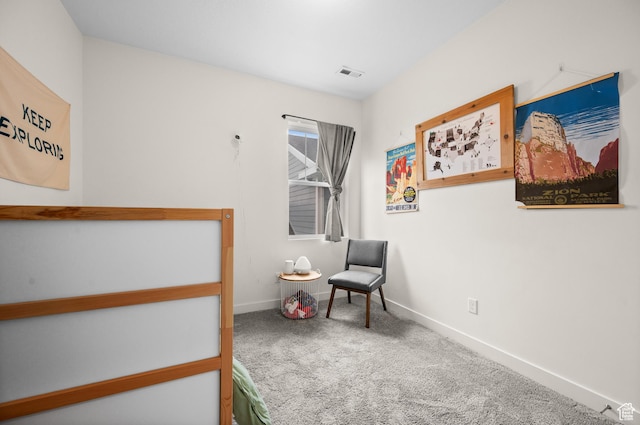 carpeted bedroom featuring baseboards and visible vents