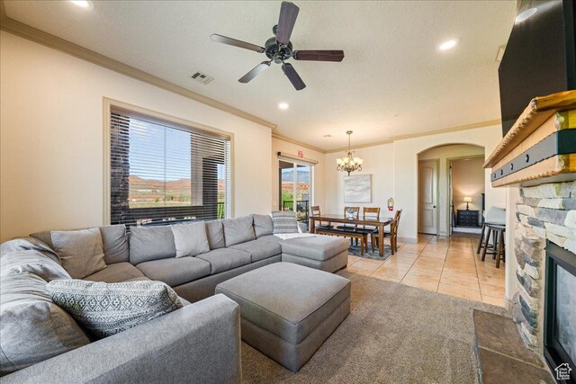 188 N 6680 W Unit 4, Hurricane, UT 84737 - living area with ceiling fan with notable chandelier, arched walkways, a fireplace, ornamental molding, and visible vents