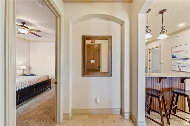 188 N 6680 W Unit 4, Hurricane, UT 84737 - corridor with a textured ceiling, crown molding, and baseboards
