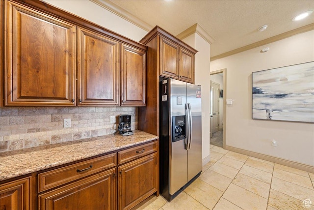 188 N 6680 W Unit 4, Hurricane, UT 84737 - kitchen featuring tasteful backsplash, light stone counters, brown cabinets, stainless steel fridge with ice dispenser, and ornamental molding