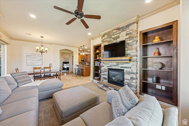188 N 6680 W Unit 4, Hurricane, UT 84737 - living area with arched walkways, ornamental molding, a stone fireplace, and ceiling fan with notable chandelier