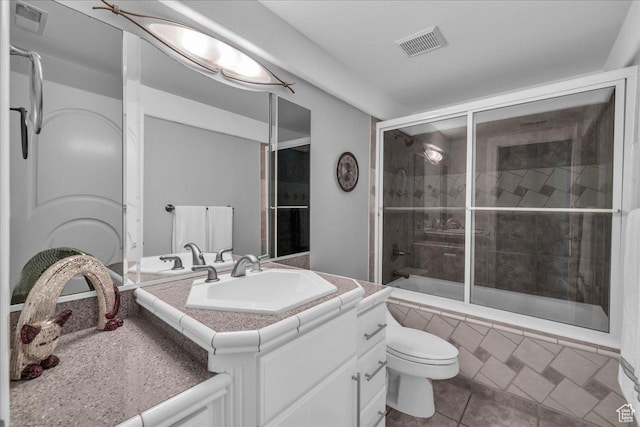 full bath with tiled shower / bath, visible vents, tile patterned floors, and toilet