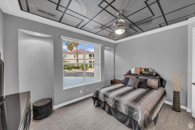 carpeted bedroom with visible vents, a ceiling fan, and baseboards