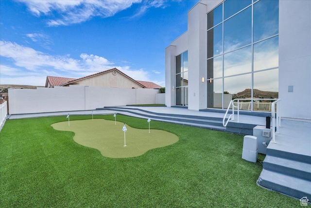 view of yard with a patio and fence