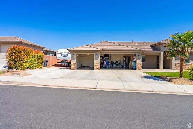 1024 Painted Cloud Pl, Washington, UT 84780 - single story home with a tile roof, an attached garage, stucco siding, and driveway
