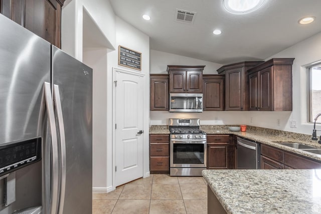 1024 Painted Cloud Pl, Washington, UT 84780 - kitchen with a sink, light tile patterned flooring, visible vents, lofted ceiling, and appliances with stainless steel finishes