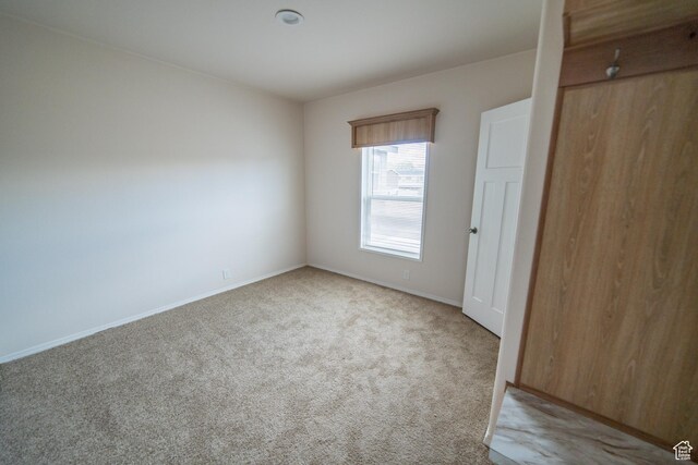 163 Eagle St, Eureka, UT 84628 - unfurnished bedroom with light carpet and baseboards