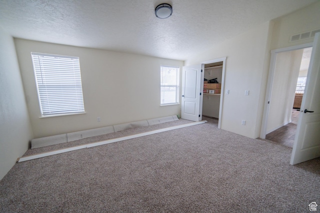 163 Eagle St, Eureka, UT 84628 - carpeted empty room featuring lofted ceiling, visible vents, and a textured ceiling