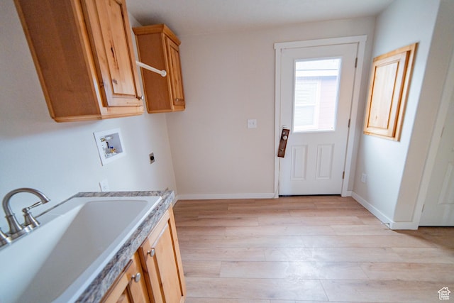163 Eagle St, Eureka, UT 84628 - laundry area featuring hookup for a washing machine, a sink, hookup for an electric dryer, light wood-style floors, and cabinet space