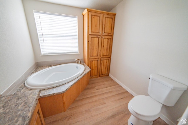 163 Eagle St, Eureka, UT 84628 - full bath featuring a bath, wood finished floors, and toilet