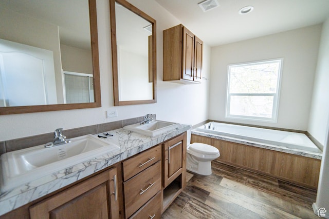 163 Eagle St, Eureka, UT 84628 - full bath with a bath, wood finished floors, visible vents, and a sink