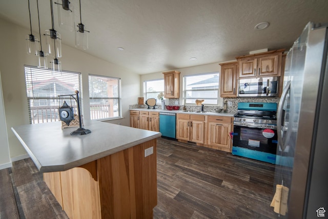 163 Eagle St, Eureka, UT 84628 - kitchen featuring light countertops, vaulted ceiling, appliances with stainless steel finishes, and dark wood-style flooring