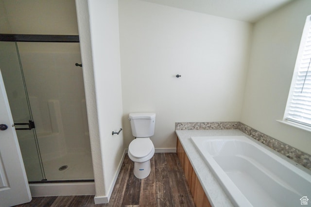 163 Eagle St, Eureka, UT 84628 - full bathroom featuring a shower stall, wood finished floors, toilet, baseboards, and a garden tub