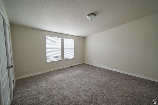 163 Eagle St, Eureka, UT 84628 - empty room featuring baseboards, carpet floors, and a textured ceiling