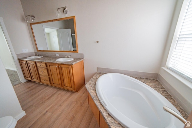 163 Eagle St, Eureka, UT 84628 - full bathroom featuring a bath, double vanity, wood finished floors, and a sink