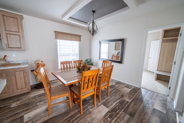 163 Eagle St, Eureka, UT 84628 - dining space featuring baseboards, a chandelier, dark wood-type flooring, and a tray ceiling