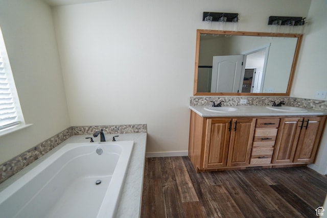 163 Eagle St, Eureka, UT 84628 - bathroom featuring a bath, wood finished floors, a sink, and double vanity
