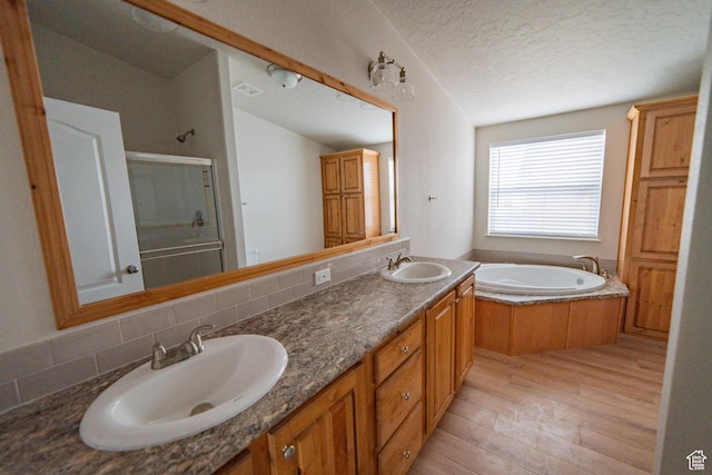 163 Eagle St, Eureka, UT 84628 - full bath featuring a bath, wood finished floors, a sink, and a stall shower