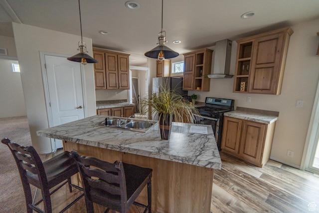 163 Eagle St, Eureka, UT 84628 - kitchen featuring a kitchen breakfast bar, stainless steel range with gas stovetop, wall chimney range hood, open shelves, and a kitchen island