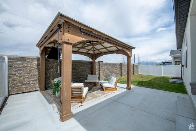 view of patio with a gazebo and a fenced backyard