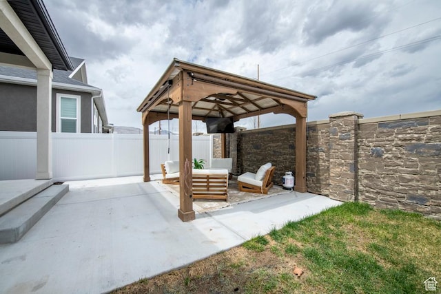 view of patio / terrace with a gazebo, fence, and outdoor lounge area