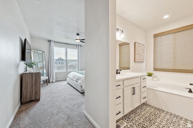 ensuite bathroom with a bath, vanity, connected bathroom, and ceiling fan