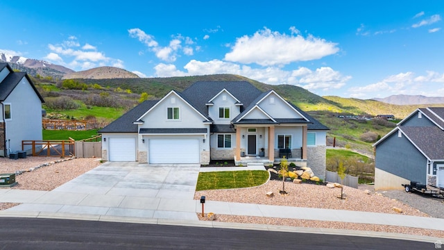 86 Elk Ridge Dr W, Elk Ridge, UT 84651 - craftsman inspired home with a mountain view, driveway, stone siding, stucco siding, and a garage