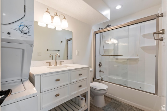 285 W Olympic Ln, Elk Ridge, UT 84651 - full bathroom with shower / bath combination with glass door, recessed lighting, stacked washer / dryer, toilet, and vanity