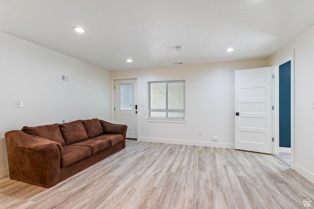 285 W Olympic Ln, Elk Ridge, UT 84651 - living room featuring recessed lighting, light wood-style floors, visible vents, and baseboards