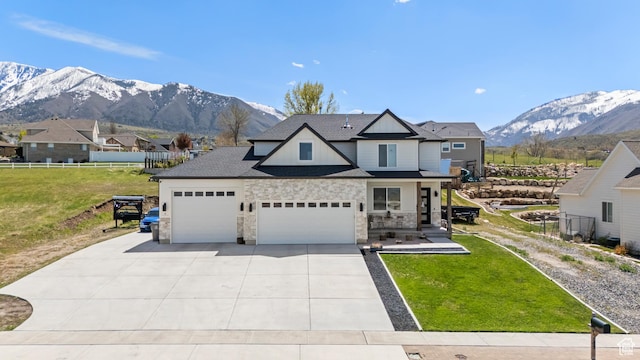 285 W Olympic Ln, Elk Ridge, UT 84651 - craftsman-style home featuring a garage, a front yard, a mountain view, and concrete driveway