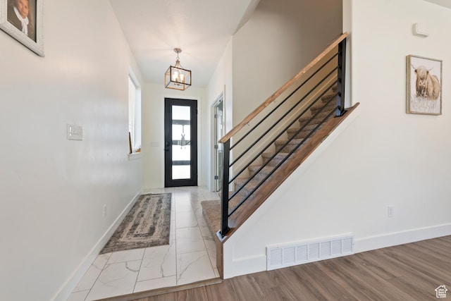 285 W Olympic Ln, Elk Ridge, UT 84651 - foyer featuring stairway, marble finish floor, baseboards, a notable chandelier, and visible vents