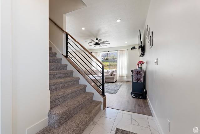 285 W Olympic Ln, Elk Ridge, UT 84651 - stairway with recessed lighting, marble finish floor, baseboards, a textured ceiling, and ceiling fan