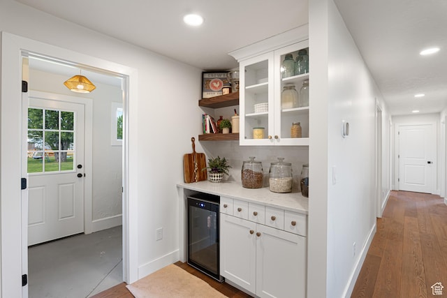 5186 W 9970 S, Payson, UT 84651 - indoor dry bar featuring beverage cooler, baseboards, recessed lighting, wood finished floors, and backsplash
