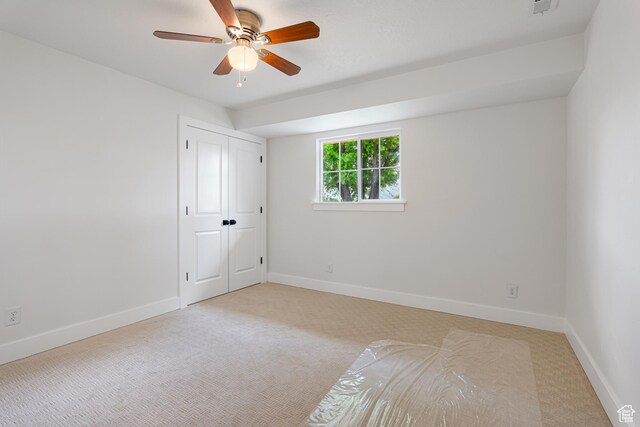 5186 W 9970 S, Payson, UT 84651 - unfurnished bedroom featuring light colored carpet, baseboards, ceiling fan, and a closet