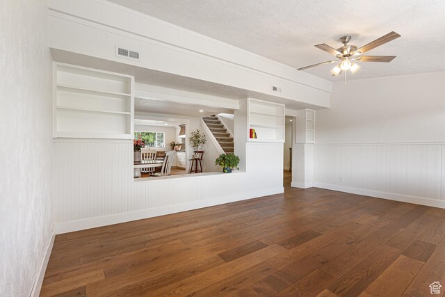 5186 W 9970 S, Payson, UT 84651 - unfurnished living room with hardwood / wood-style floors, stairway, baseboards, and a wainscoted wall