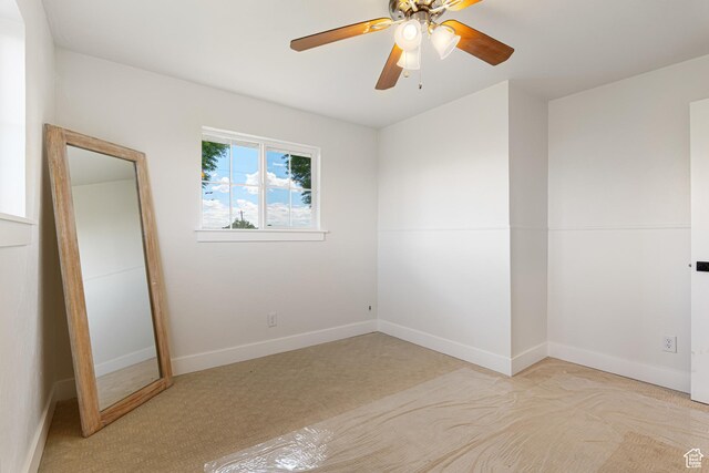 5186 W 9970 S, Payson, UT 84651 - unfurnished bedroom featuring light carpet, baseboards, and ceiling fan