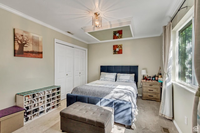 572 S Main St, Kaysville, UT 84037 - carpeted bedroom with a closet, visible vents, and ornamental molding