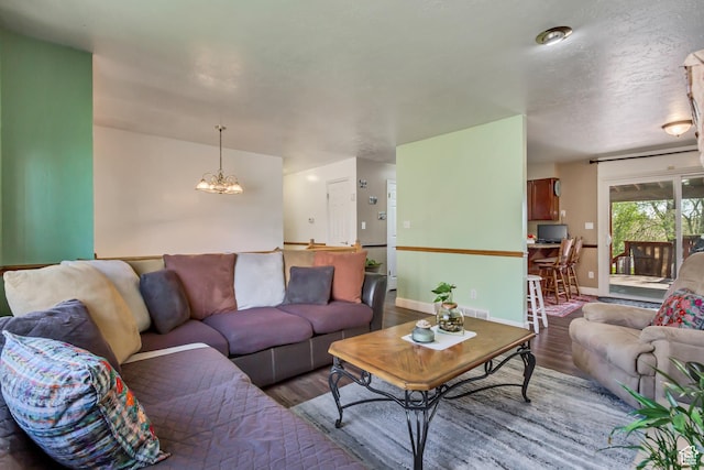 572 S Main St, Kaysville, UT 84037 - living area with baseboards, a chandelier, wood finished floors, and visible vents