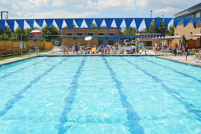 pool featuring a patio and fence