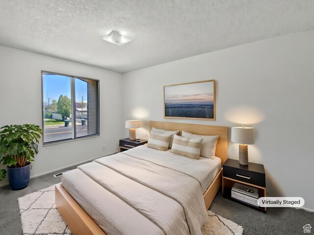 3445 W 3650 S, West Valley City, UT 84119 - carpeted bedroom with baseboards and a textured ceiling