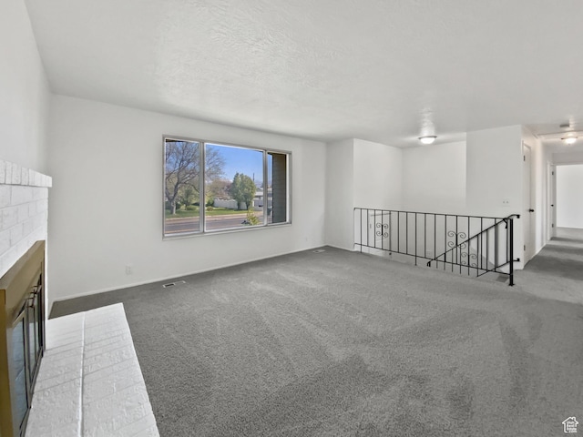 3445 W 3650 S, West Valley City, UT 84119 - unfurnished living room featuring carpet floors and a fireplace