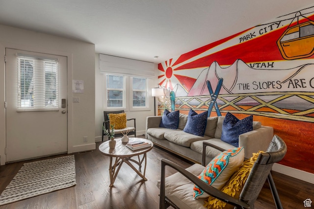living area featuring wood finished floors and baseboards