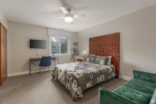 carpeted bedroom with a ceiling fan and baseboards