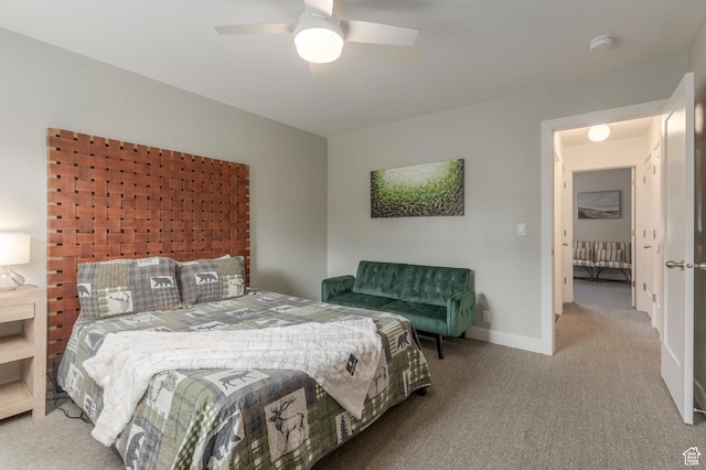 bedroom with carpet, baseboards, and ceiling fan
